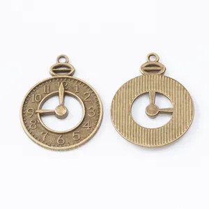 Vintage bronze alloy clock pendant for DIY crafts showing front and back detail