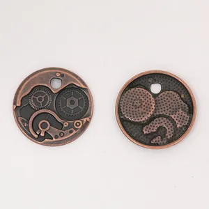 Detail of bronze steampunk gears charms with intricate mechanical relief and hanging hole