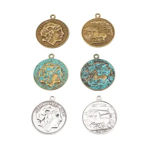 Antique Alexander the Great coin pendants in bronze, verdigris, and silver finishes