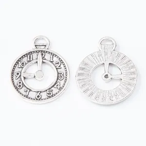 Vintage silver alloy clock pendant for DIY jewelry showing front and back texture