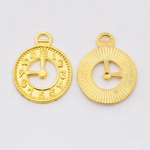 Pair of golden vintage alloy clock charms for DIY jewelry making with numeric details