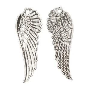 Pair of antique silver wing charms with detailed feather texture for DIY jewelry making