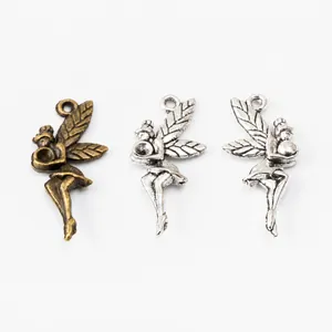 Macro shot of antique bronze and silver fairy wing charms for DIY jewelry making