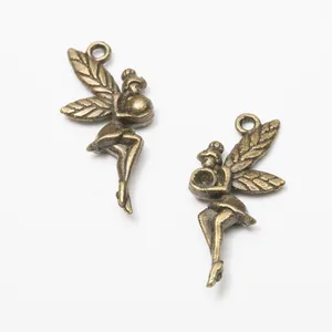 Pair of vintage bronze fairy angel charms with detailed wing textures and hanging loops