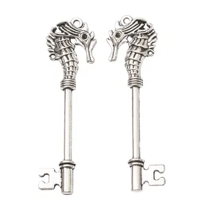 Pair of vintage seahorse key pendants in antique silver finish with detailed engravings