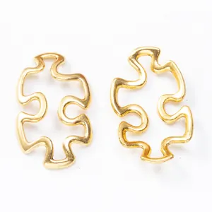 Set of two puzzle piece charms in polished gold finish for DIY jewelry making