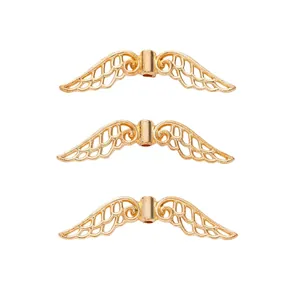 Three gold vintage zinc alloy wing beads for DIY jewelry making with detailed texture