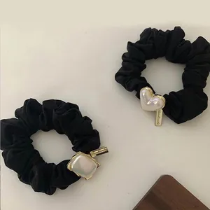 Handmade elastic black hair scrunchies with white faux pearls and heart metal tags
