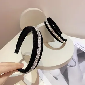 Detailed close-up of velvet padded headbands with sparkling rhinestone embellishments