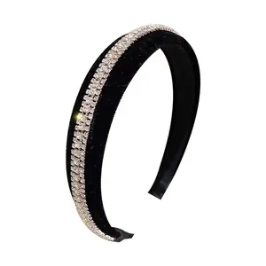 Retro velvet headband in black with double row crystal rhinestones on a white background