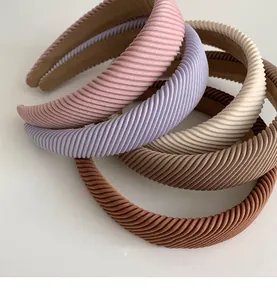 Detail of wide striped sponge headbands in various colors with thick vintage texture