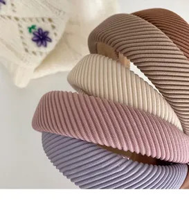 Close-up of ribbed texture sponges headbands in muted earth tones for hair styling