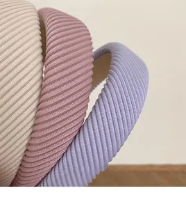 Detailed macro view of the textured fabric and thick sponge padding on these headbands