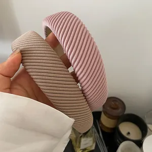 Chic wide diagonal striped knit headbands in pink and khaki colors for women