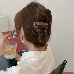 Modern matte resin ponytail hair clip set shown on model for an elegant daily look