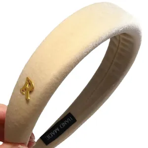 Chic beige plush padded headband with golden metal letter R and handmade label