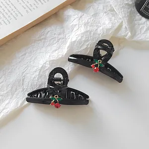 Elegantes Set schwarzer Haarklammern mit funkelndem roten Strass-Kirschornament