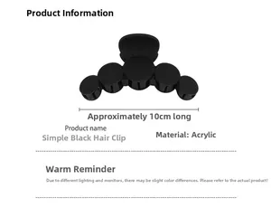 Détail d'une pince à cheveux de 10cm en acrylique noir mat au design minimaliste chic