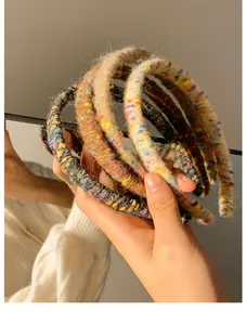 Detailed close-up of colorful wool knit headbands with textured fiber and hand-woven style
