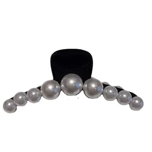 French vintage black matte hair claw clip with gradient pearls in a minimalist design