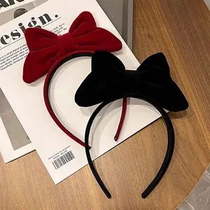 Elegant red and black velvet headband with large bows, festive winter hair accessories