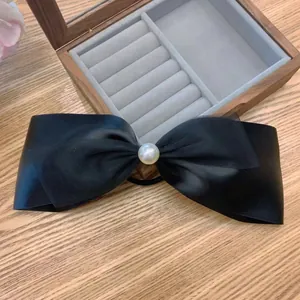 French vintage black satin mesh bow hair tie with a large white pearl accent