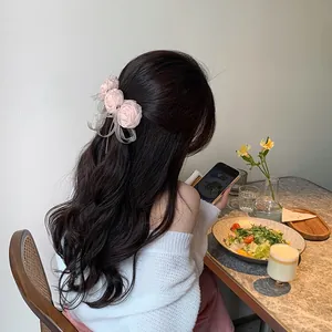 Romantic pink rose bow hair clip for women featuring elegant organza ribbon layers