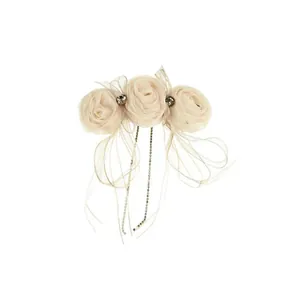 Romantic floral hair clip with pink fabric roses, ribbon bow, and beaded tassels