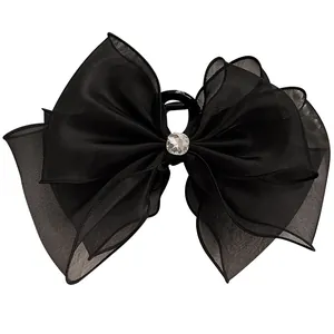 Grande molletta per capelli con fiocco nero in organza e cristallo centrale lucido