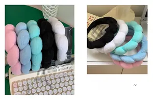 Macro detail of soft plush sponge headbands in five pastel colors for face washing