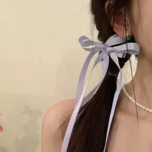 Elegant light blue ribbon bow hair clip with long tassels for women's hairstyles