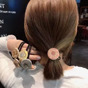 Floral resin elastic hair ties in pastel colors for women with crystal center details