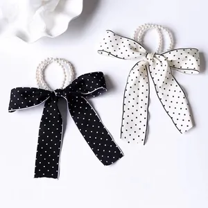 Elegant pearl hair scrunchies with polka dot ribbon bows in black and white set
