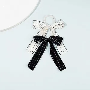 Chic pearl hair tie set featuring black and white polka dot chiffon bow hair accessories