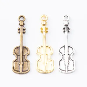 Vintage violin charms for DIY jewelry in antique bronze, gold, and silver finishes