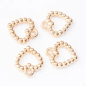 Vier goldene herzförmige Perlenanhänger aus Legierung für DIY-Schmuckzubehör