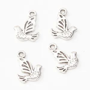 Vintage silver alloy peace dove charms for DIY jewelry making with feather textures