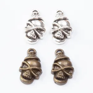 Set of four skull pendants in silver and bronze finishes for DIY jewelry making crafts