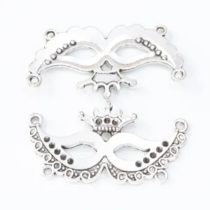 Retro silver alloy butterfly mask charm with crown detail and four connector holes