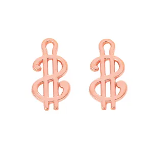 Macro shot of rose gold dollar sign pendants for DIY jewelry making accessories