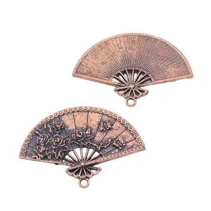 Vintage bronze fan charms with floral and ribbed patterns for DIY jewelry making