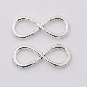 Set of two vintage silver alloy infinity symbol connectors for DIY jewelry making