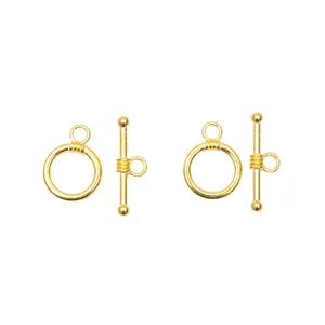 Close-up of golden alloy toggle clasps for DIY jewelry making and necklaces