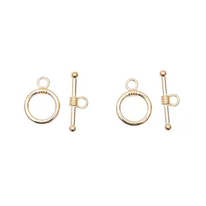 Detail shot of light gold toggle clasps for jewelry making with T-bars and rings