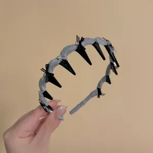 Elegant lace wave headband with sparkling cubic zirconia and punk-style black spikes