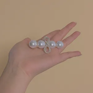 Elegant Korean style hair clip with white pearls and a beaded bowknot on gold metal