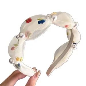 Embroidered organza headband with pearls and fruit patterns on white background