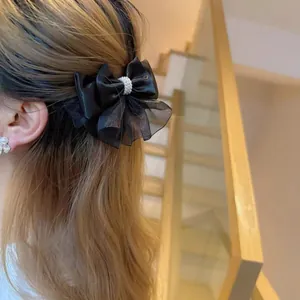 Elegant multi-layer black organza bow hair clip with pearl detail for women