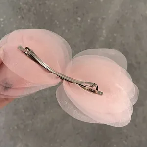Pink multi-layer organza bow hair clip with a metal spring clasp for women