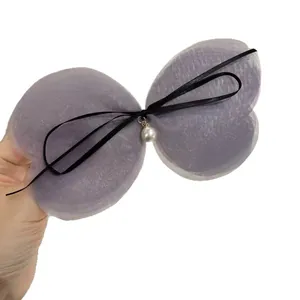 Elegant multi-layered purple mesh butterfly hair clip with pearl and black ribbon bow